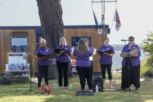 Marchwood Military Wives performing on the Clifftop in front of the NCI Stone Point station.