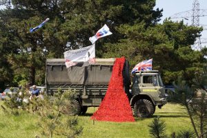 A river of Poppies descends from one of the Military vehicles exhibited on the Clifftop.