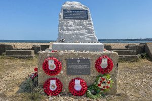 The D-Day Memorial amongst the Mulberry Harbour construction remains marks the embarkation point for many of the Troops